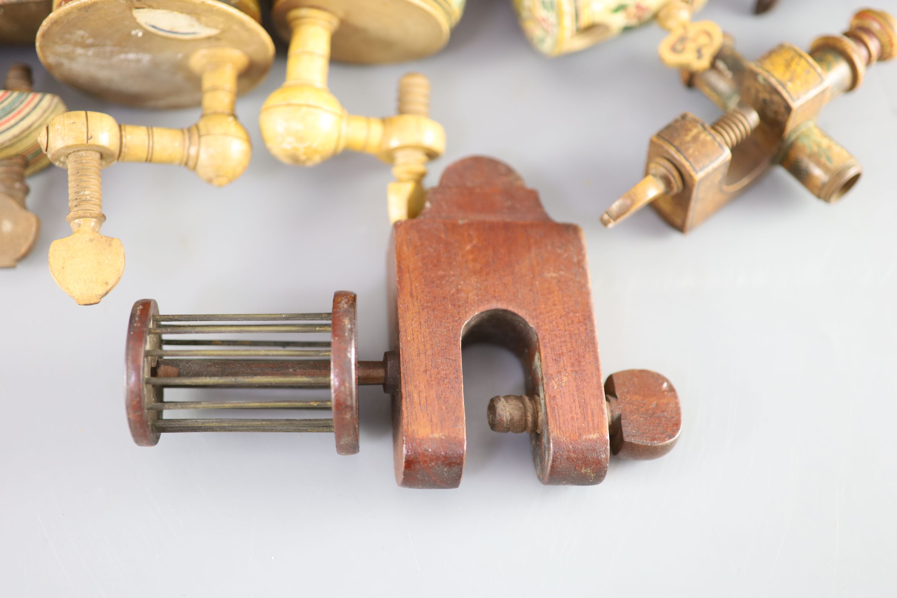 A collection of assorted Victorian sewing clamps and other accessories